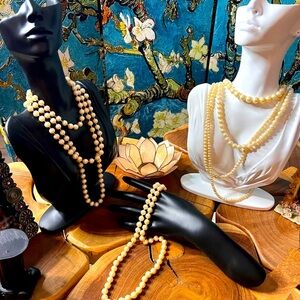 Three vintage pearl necklaces.